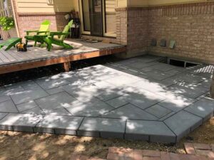 The blue outdoor tile was a stunning color compliment to the home, wooden patio and yard in this Longmont, CO home.