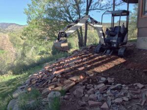 SR Custom Stone started with this deteriorating retaining wall and underused landscape area.