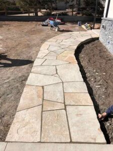 Adding spice to this Boulder home is a sidewalk created from Colorado Buff flagstone.