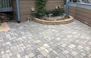 Stone enclosed gardens spark the outdoor living area for this Lafayette, CO, home.