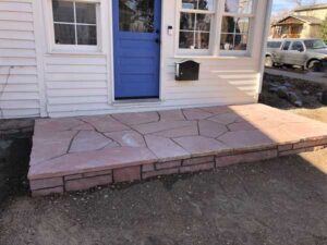 A raised red flagstone porch in Louisville, CO.