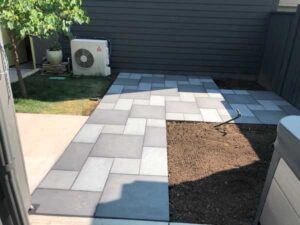 Blue and mixed-blue porcelain pavers used create a stone-like sidewalk.