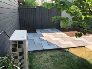 Blue and mixed-blue porcelain pavers create a patio with light and dark finishes.