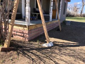 The red strip stone accents the entire front porch of this Longmont, CO, home.